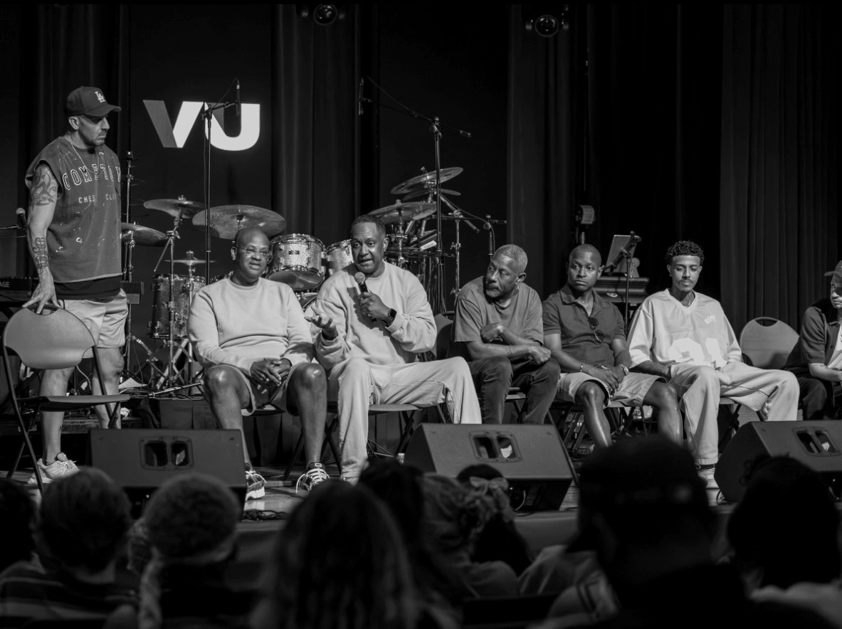 VocalizeU panel discussion on stage at the camp